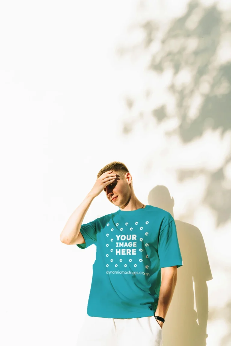 Man Wearing Teal T-shirt Mockup Front View Template