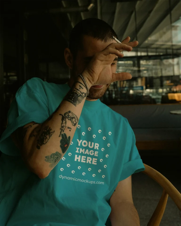 Man Wearing Teal T-shirt Mockup Front View Template