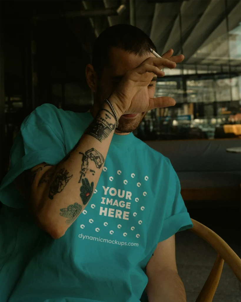 Man Wearing Teal T-shirt Mockup Front View Template