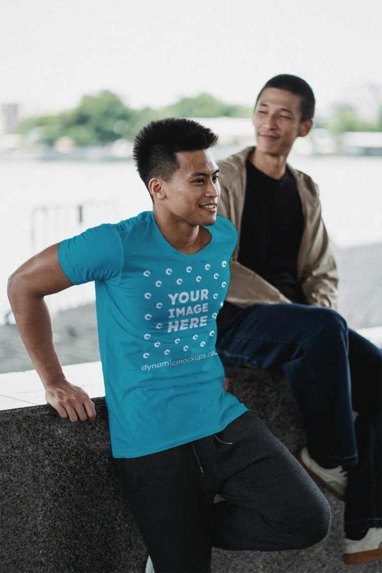 Man Wearing Teal T-shirt Mockup Front View Template