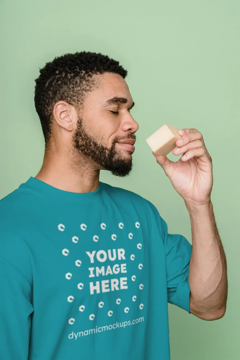 Man Wearing Teal T-shirt Mockup Front View Template