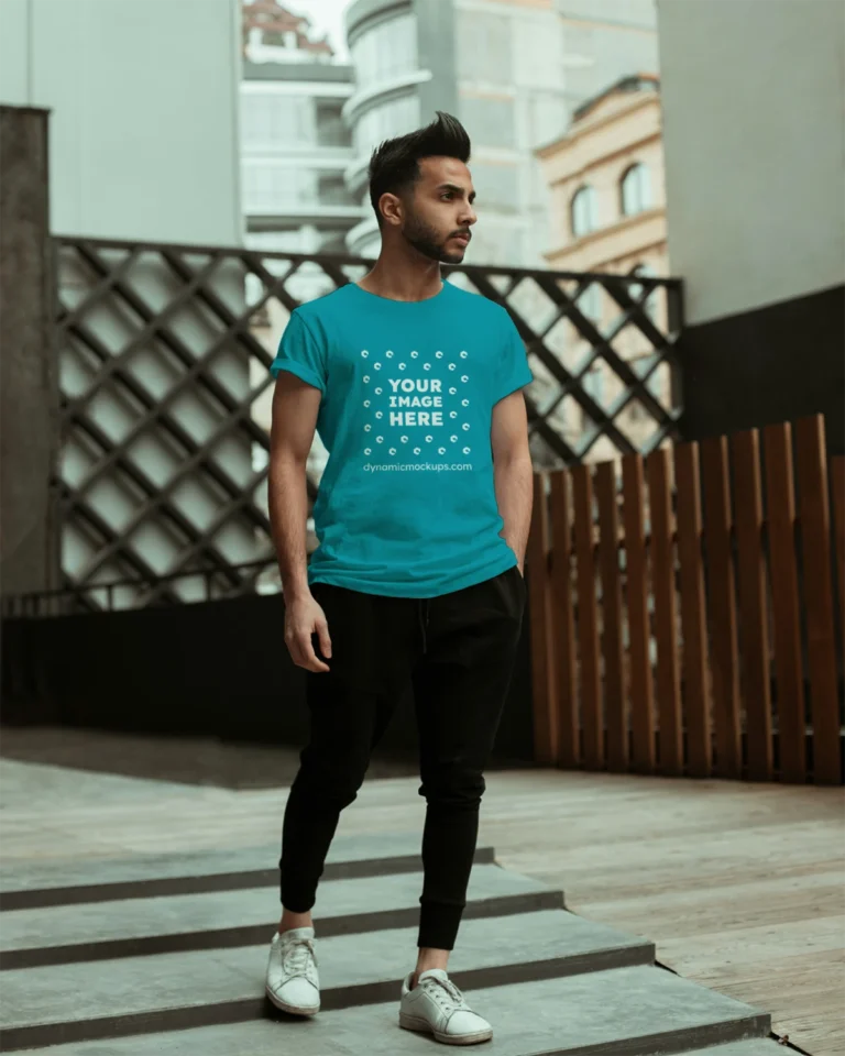 Man Wearing Teal T-shirt Mockup Front View Template