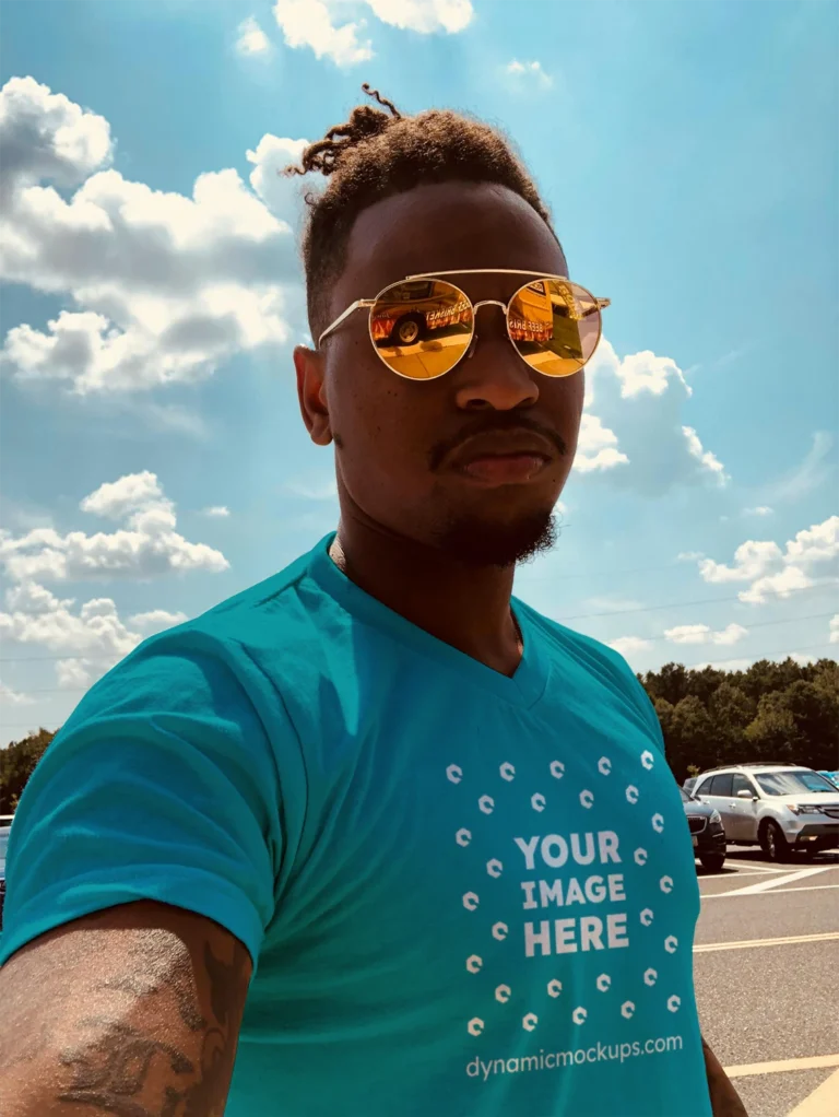 Man Wearing Teal T-shirt Mockup Front View Template
