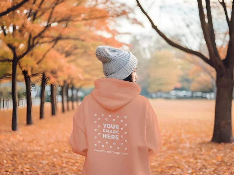 Woman Wearing Peach Hoodie Mockup Back View Template