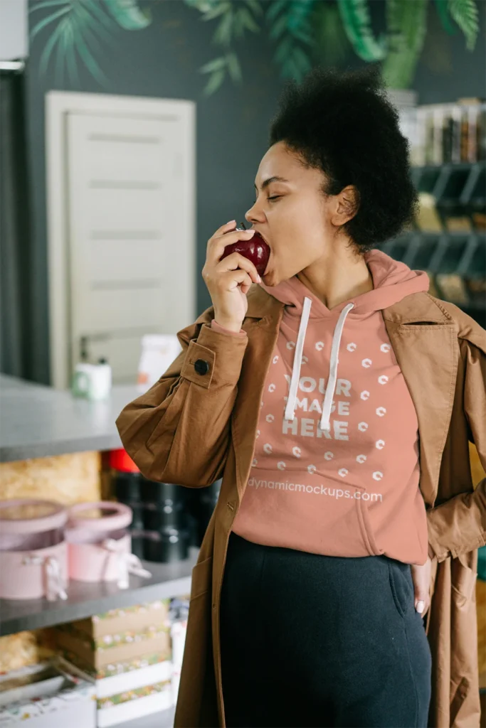 Woman Wearing Peach Hoodie Mockup Front View Template