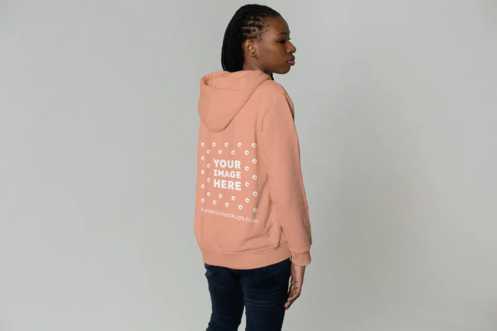 Woman Wearing Peach Hoodie Mockup Back View Template