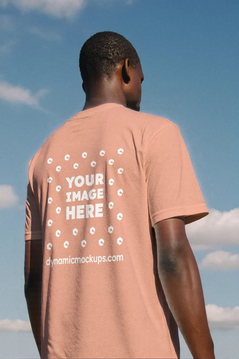 Man Wearing Peach T-shirt Mockup Back View Template