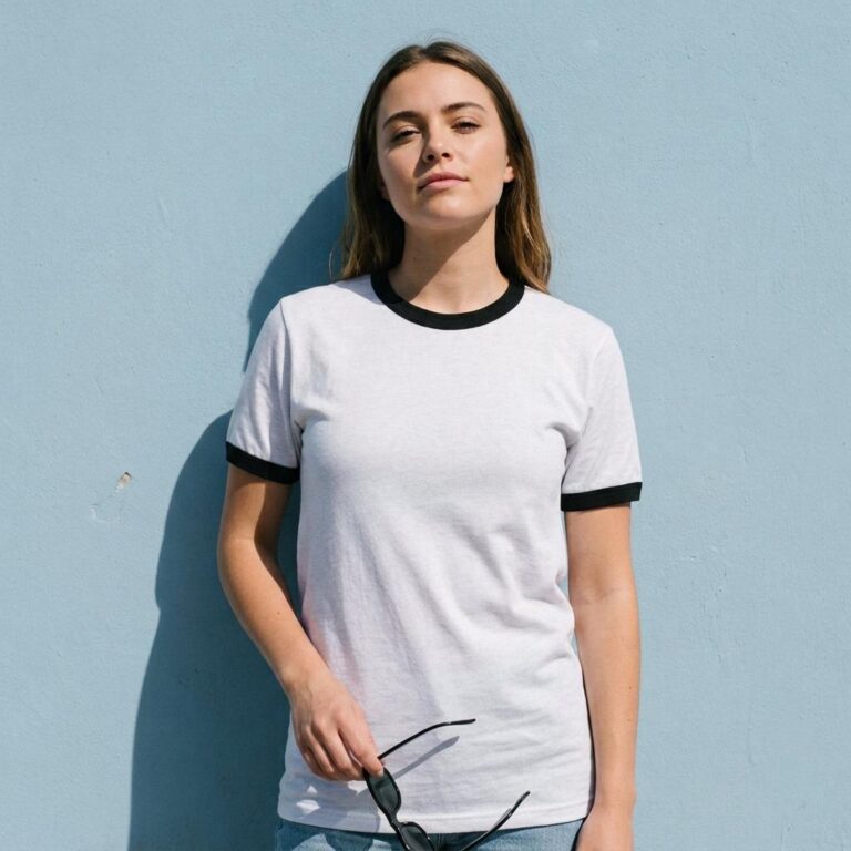 Ringer Tee Mockup on a Powder-Blue Wall with Hard Sun Shadow
