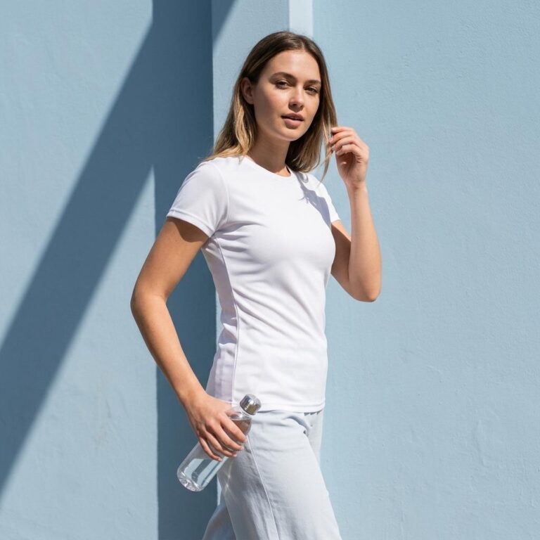 Fitted Women’s T-Shirt Mockup with Powder-Blue Wall and Midday Shadow